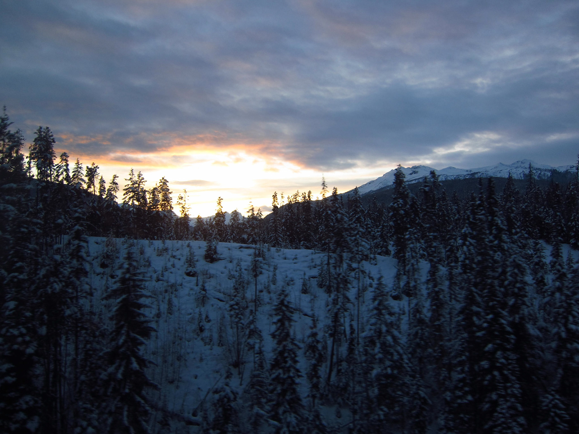The sky is ignited by the setting sun in the Rocky Mountains