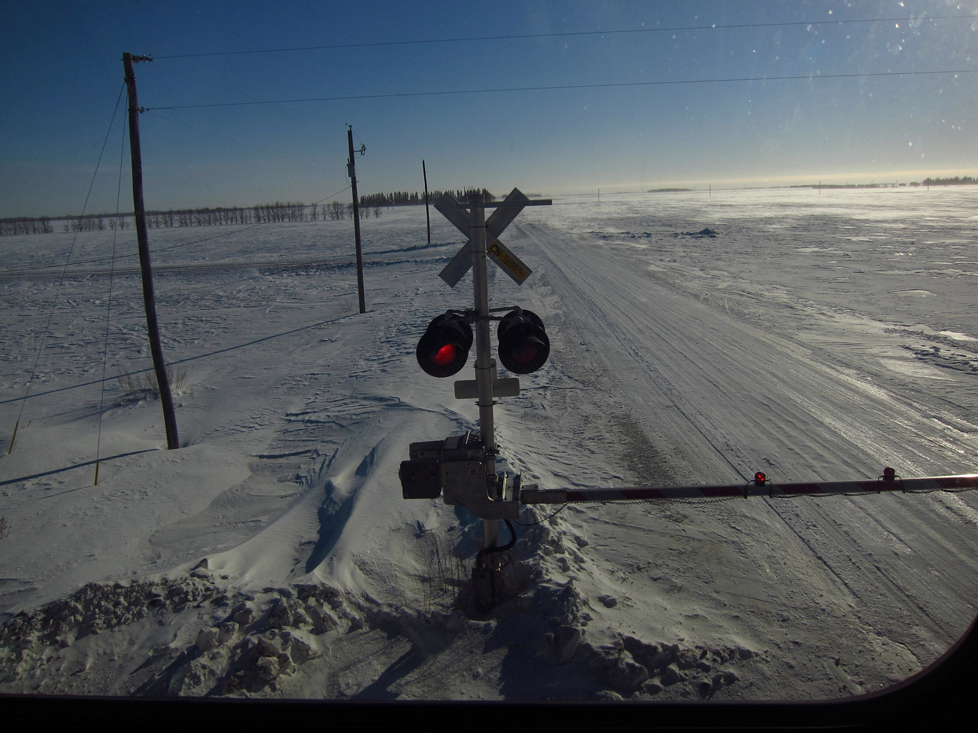The flat, empty prairie landscape in the winter is hyptnotizing