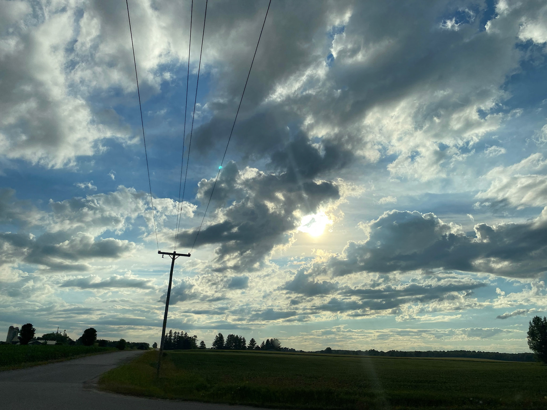 Sun and clouds and sunset during ride to the cottage - July 28-2022