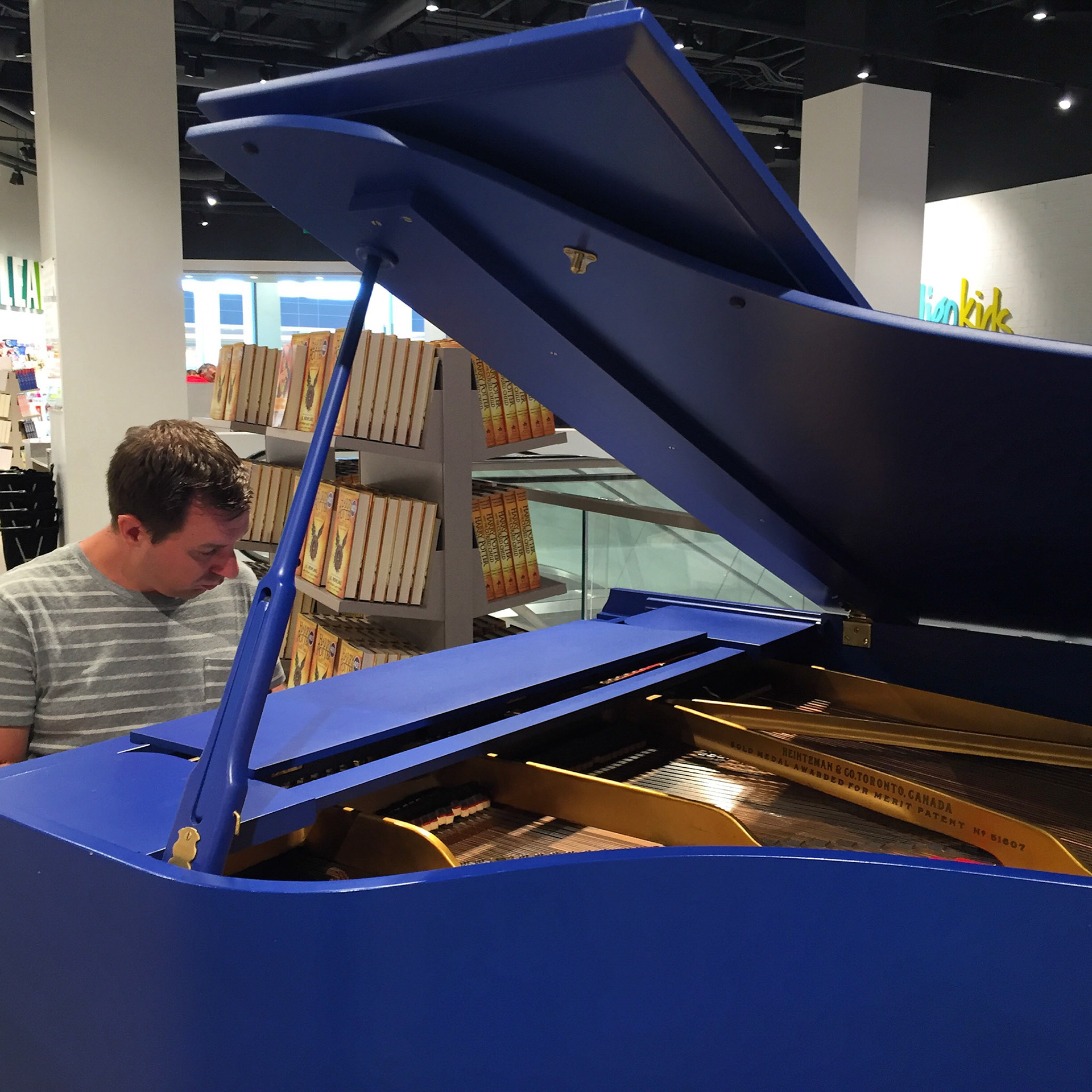 A blue grand piano at Indigo Sherway