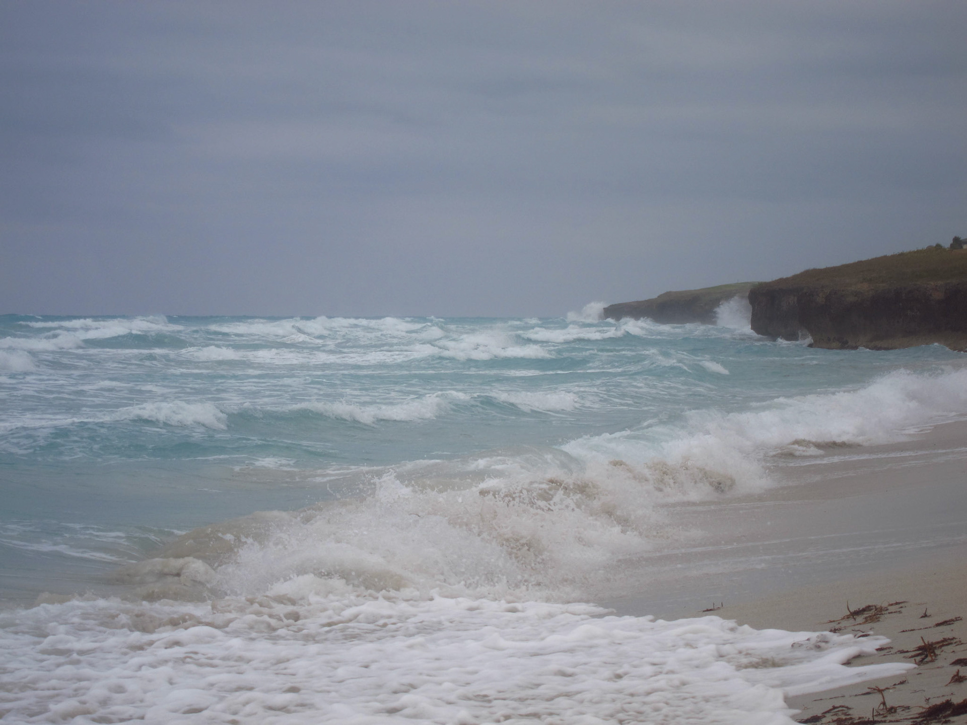 In the distance from our resort - big waves crashing on the shore