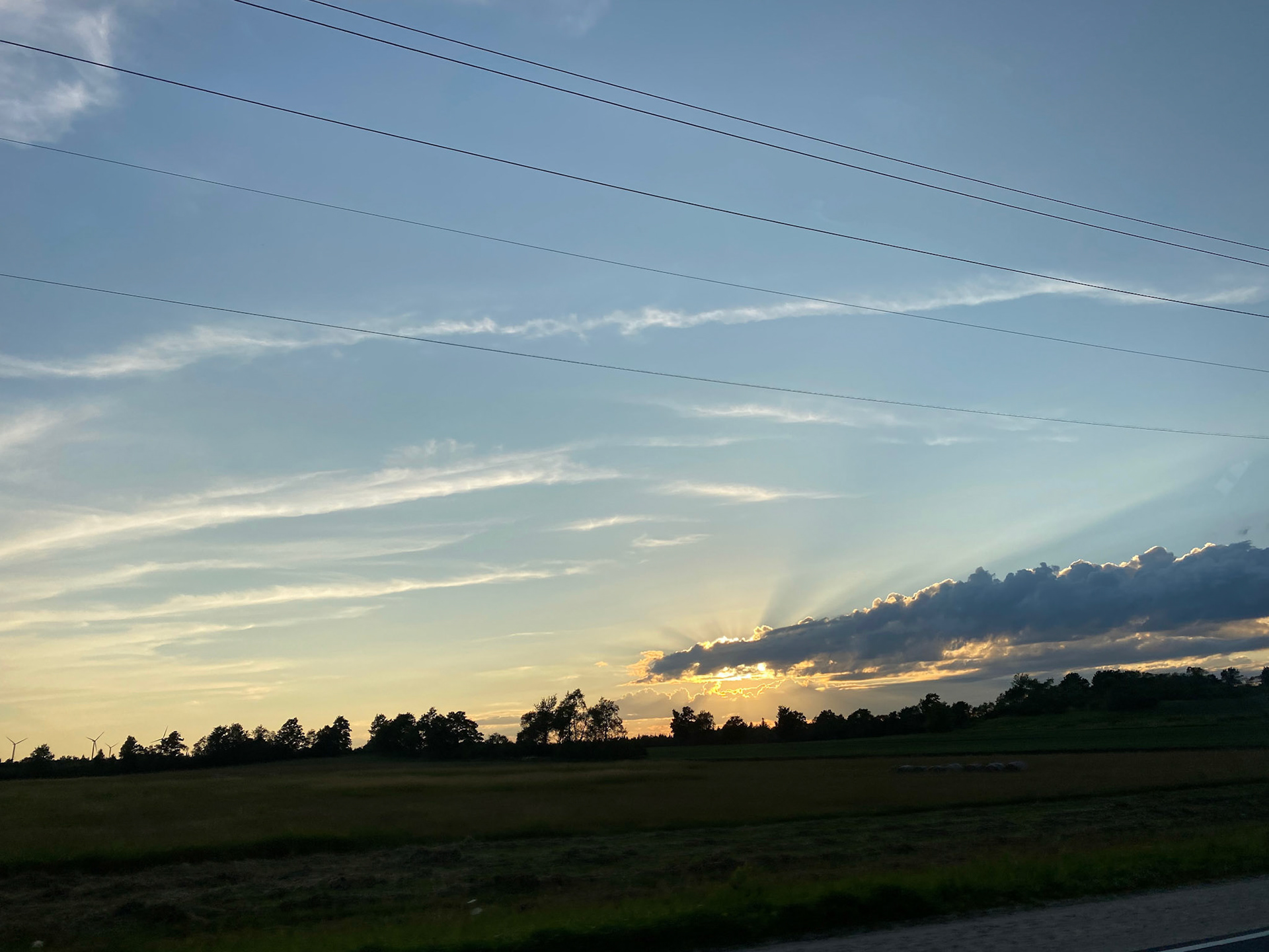 Sun and clouds and sunset during ride to the cottage - July 28-2022
