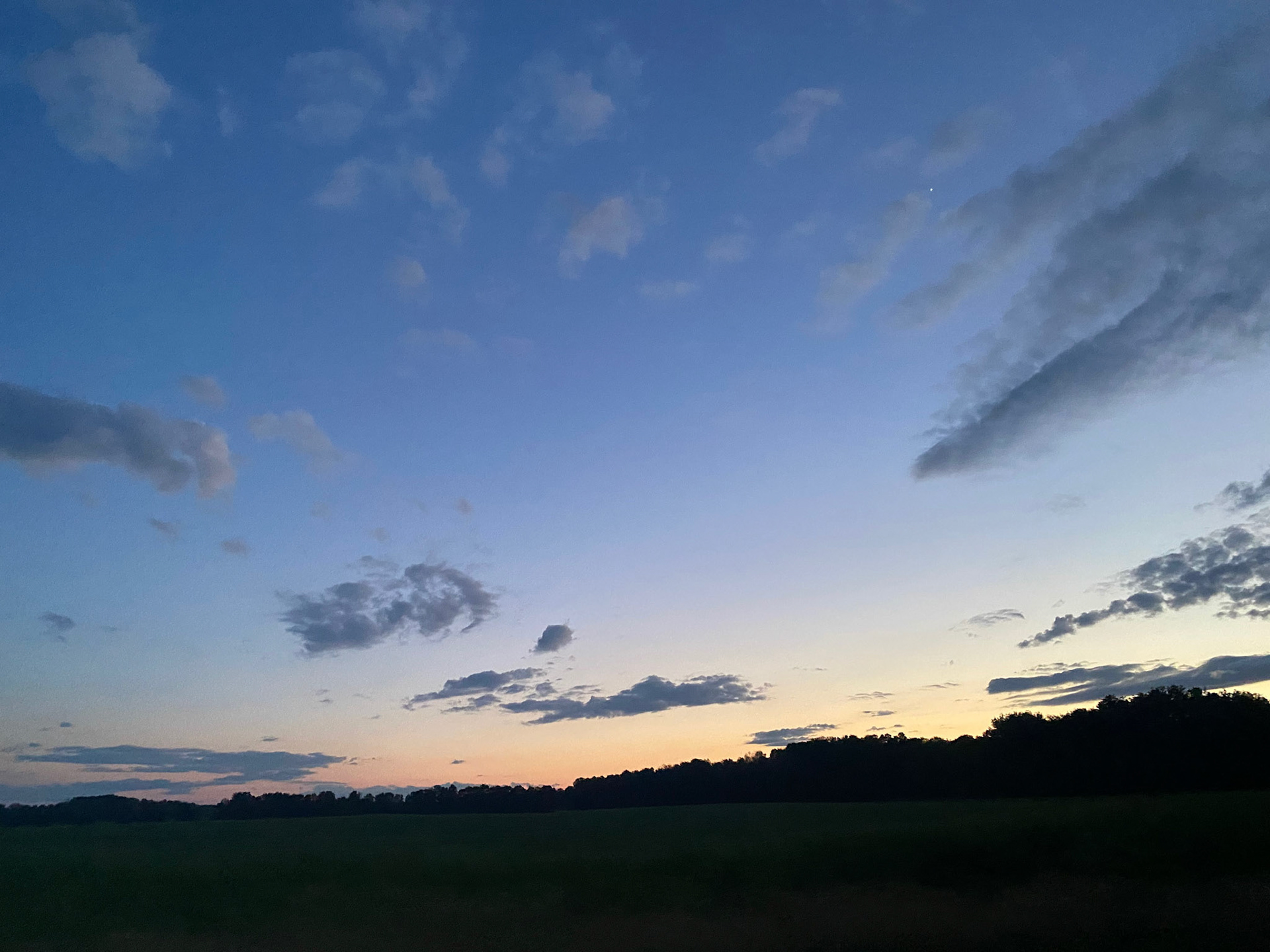 Sun and clouds and sunset during ride to the cottage - July 28-2022