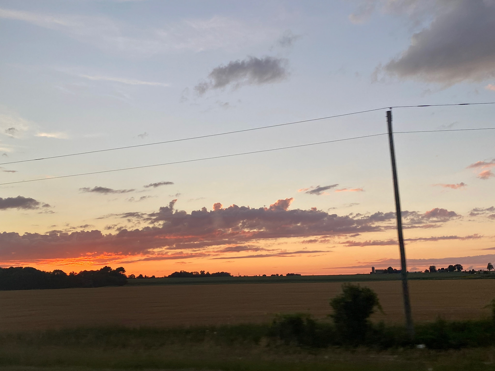 Sun and clouds and sunset during ride to the cottage - July 28-2022