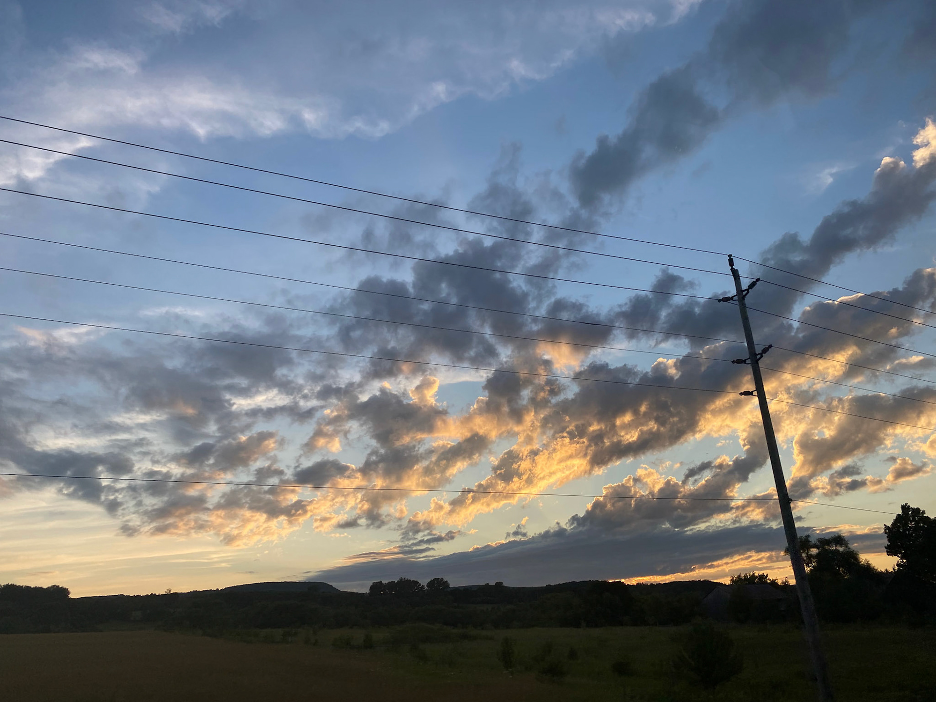 Sun and clouds and sunset during ride to the cottage - July 28-2022