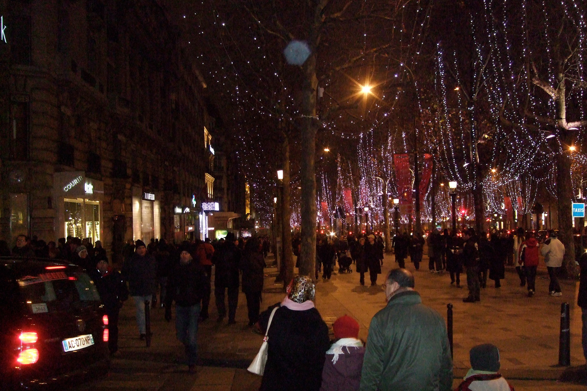 The crowd gets thicker along the Champs Elysees
