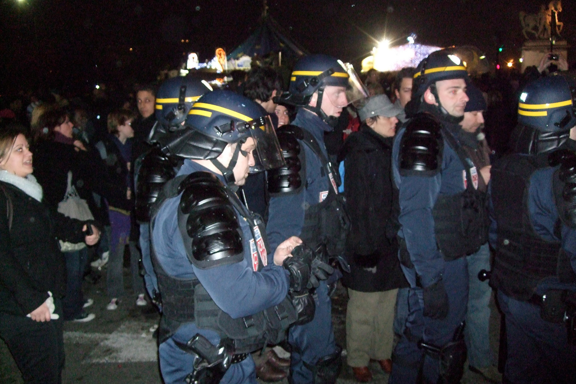 Police in heavy armour by the Eiffel Tower