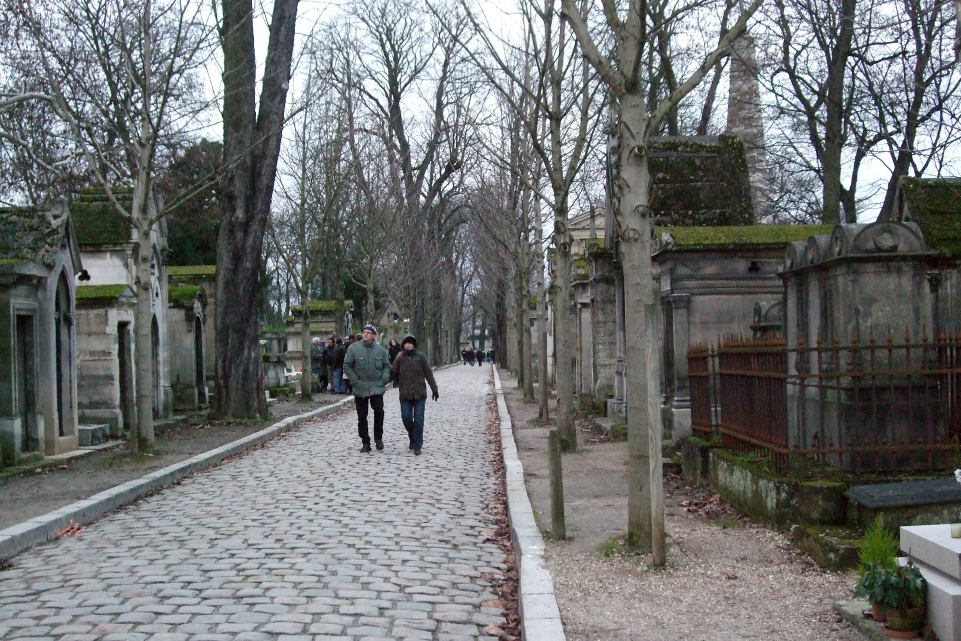 The quiet paths, trees and towering monuments at Pere Lachaise cemetery