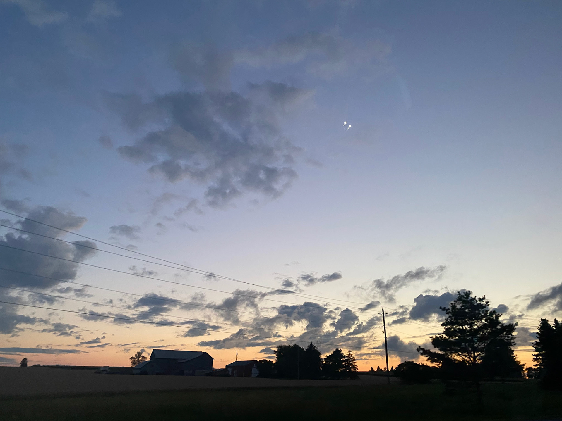 Sun and clouds and sunset during ride to the cottage - July 28-2022