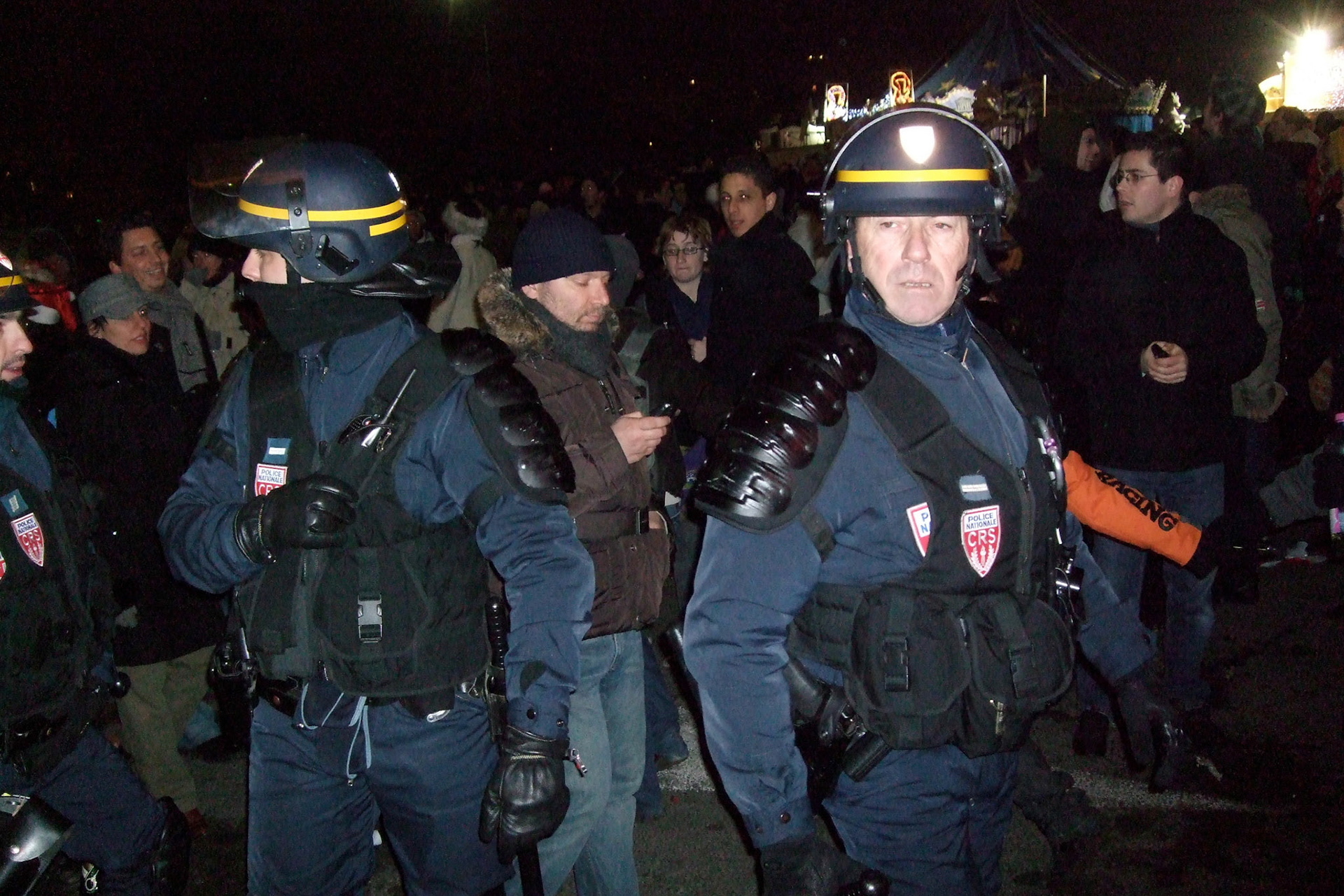 Police in heavy armour by the Eiffel Tower