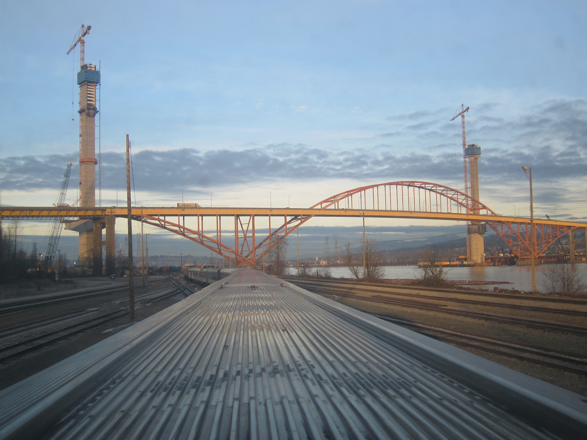 The Canadian approaches Vancouver: passing under the Port Mann Bridge that connects Coquitlam to Surrey across the Fraser River. A replacement bridge is being built