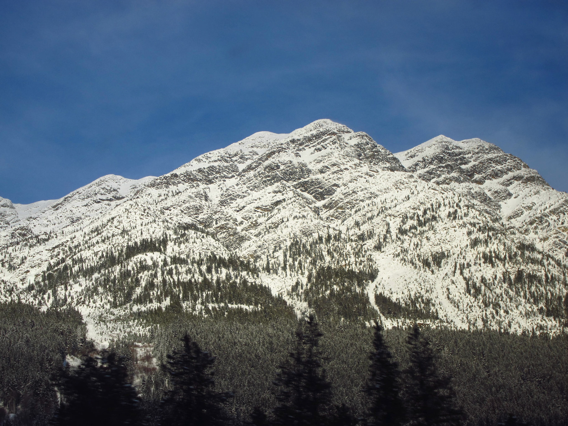 The afternoon sun lights up the Rocky Mountains