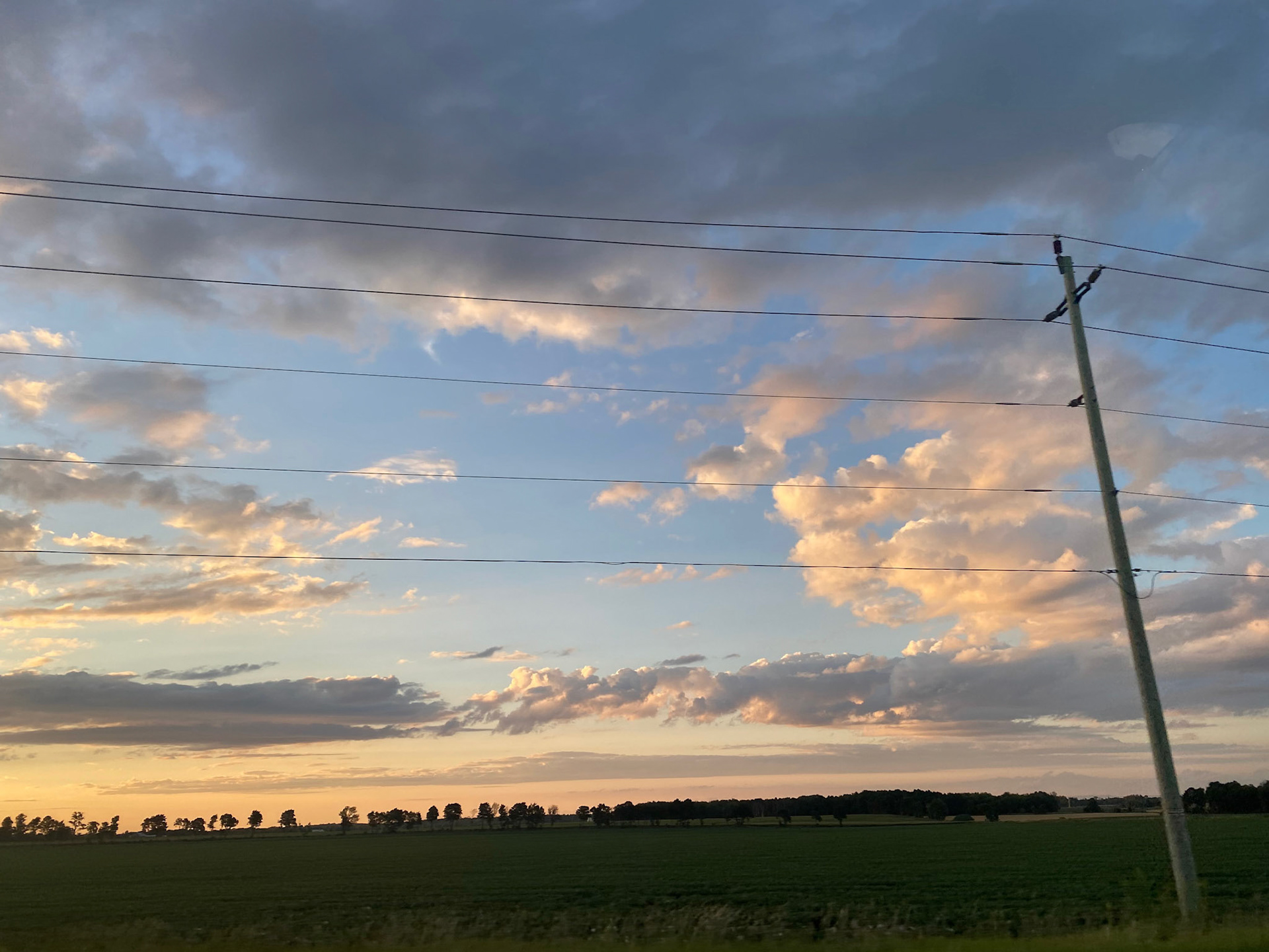 Sun and clouds and sunset during ride to the cottage - July 28-2022