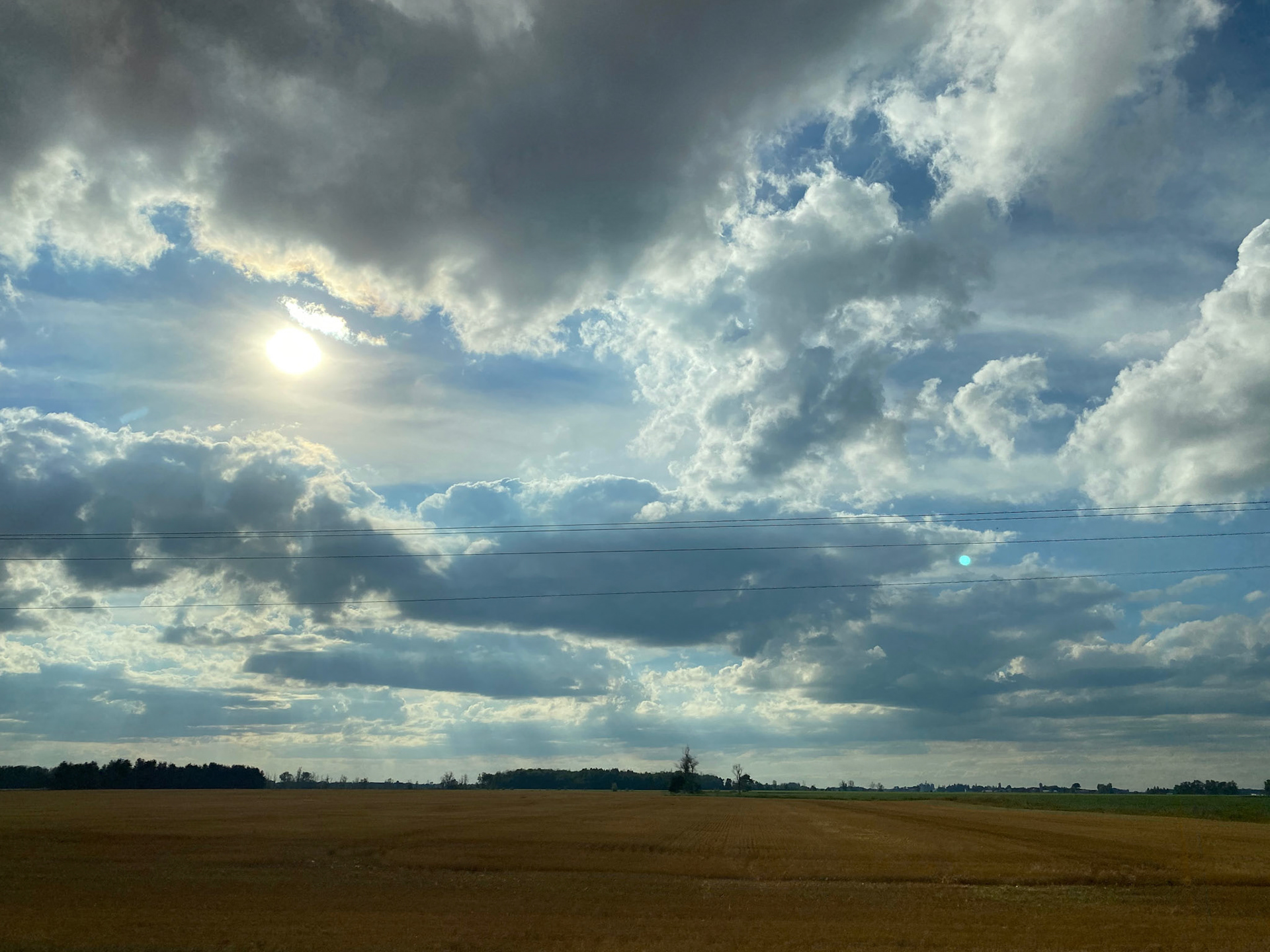 Sun and clouds and sunset during ride to the cottage - July 28-2022