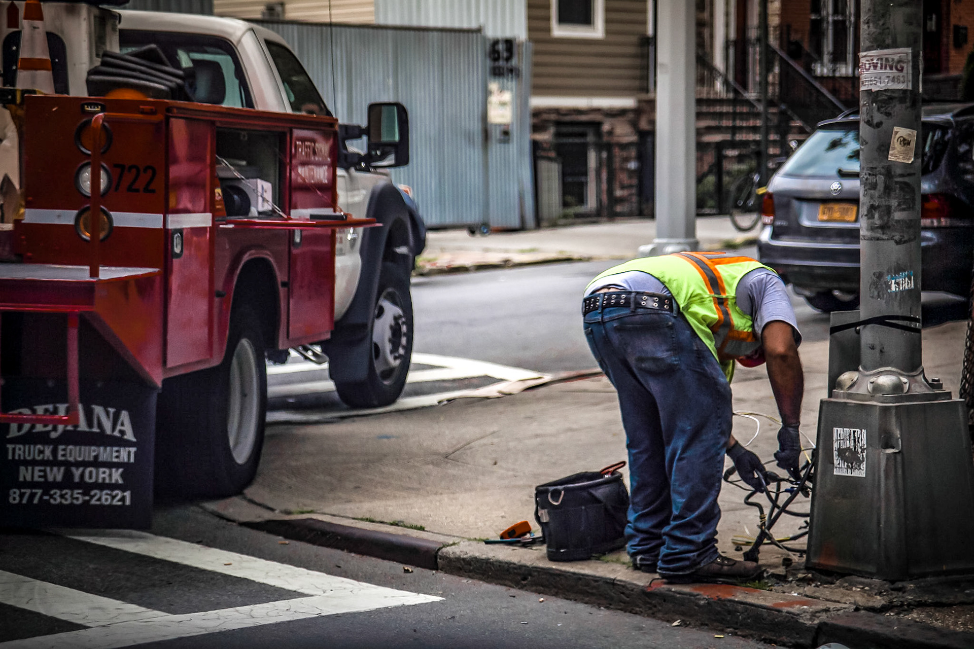 Man Fixing The Light Post