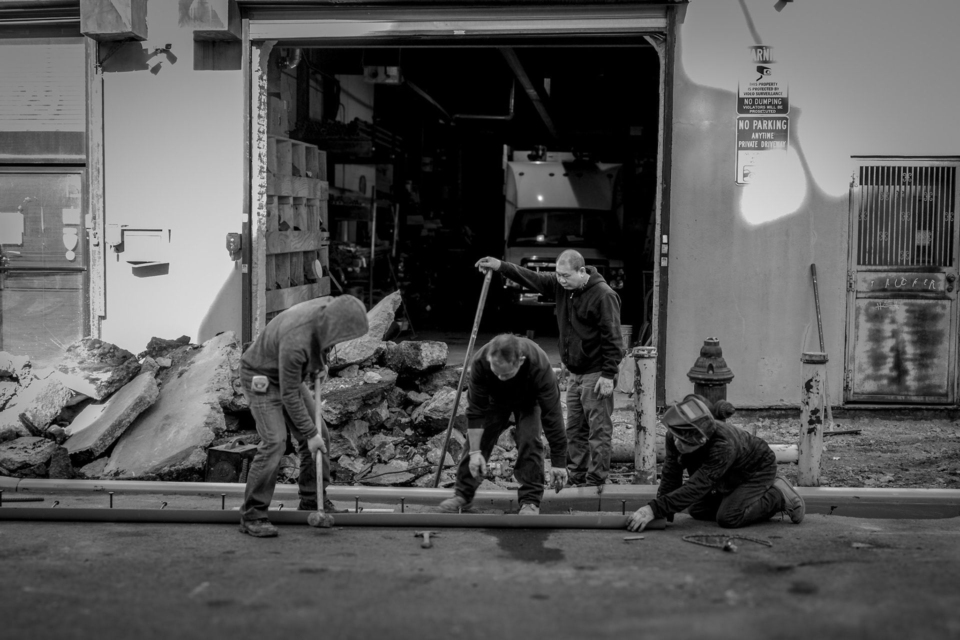 Men working on some sort of Pipe