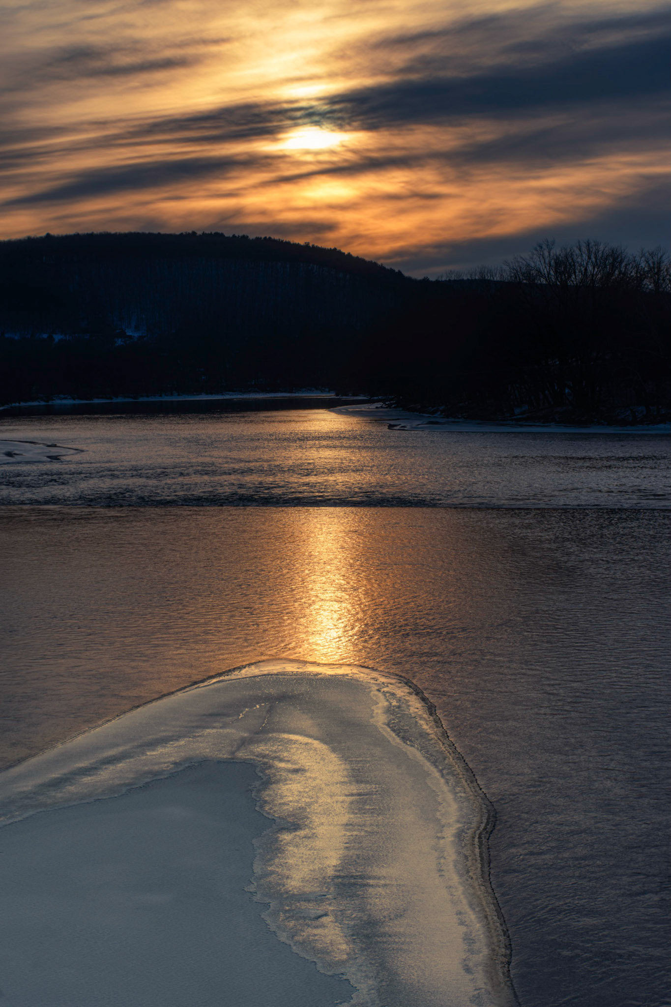Setting Sun with River, Ice and Clouds
