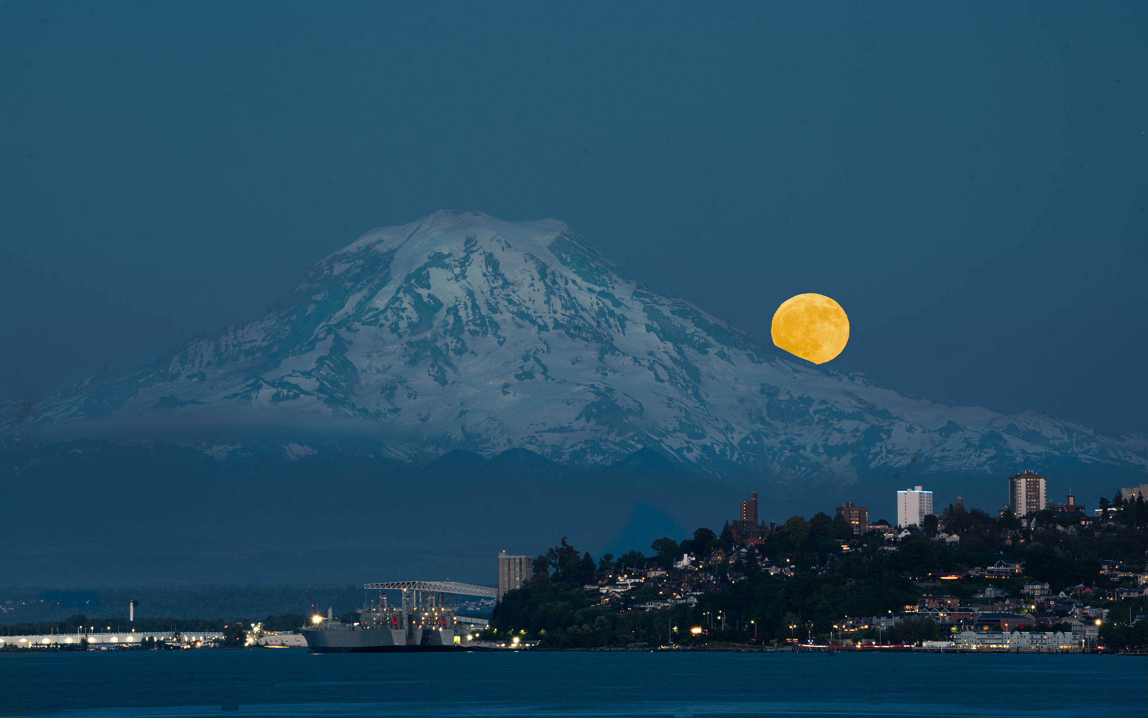 Full moon rising behind Mt. Rainier