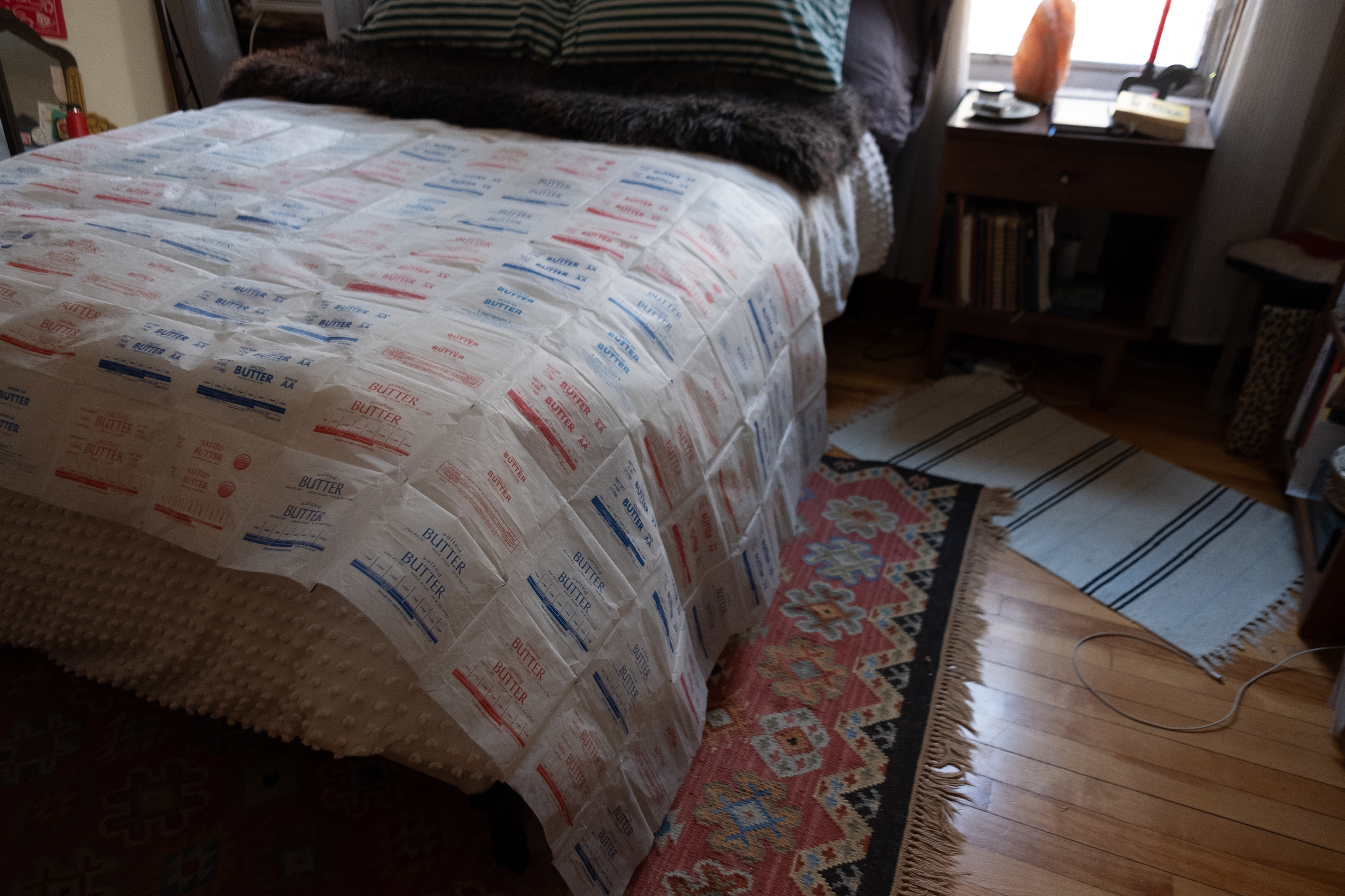 Untitled, Machine-sewn butter wrappers, 2024