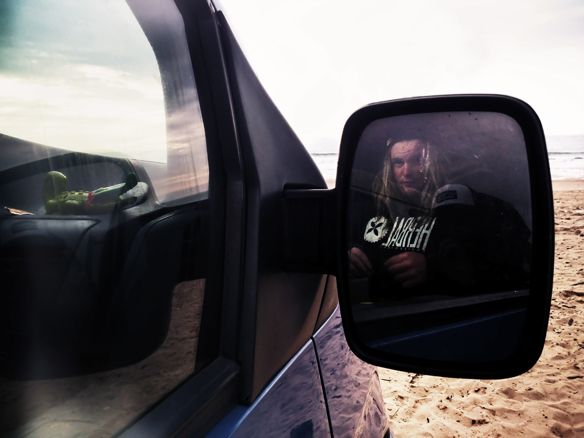 A Friend Reflected In A Van Mirror