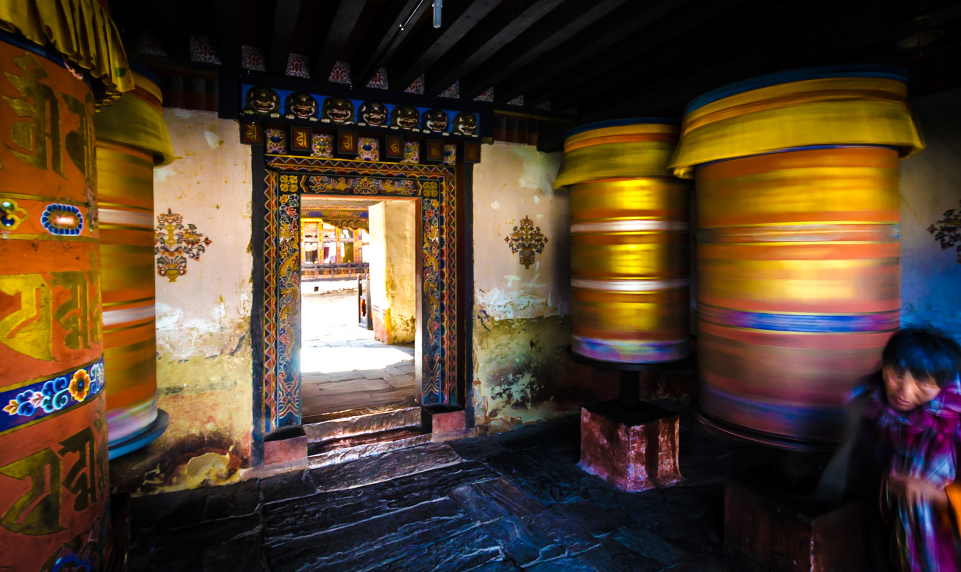 Buddhist prayer wheels at the main gate for the Jamba Lhakhang temple in the Bumthang region.The temple is one of the oldest temples in the kingdom of Bhutan. It was founded by Songtsen Gampo, a Tibetan King in the 7th century AD