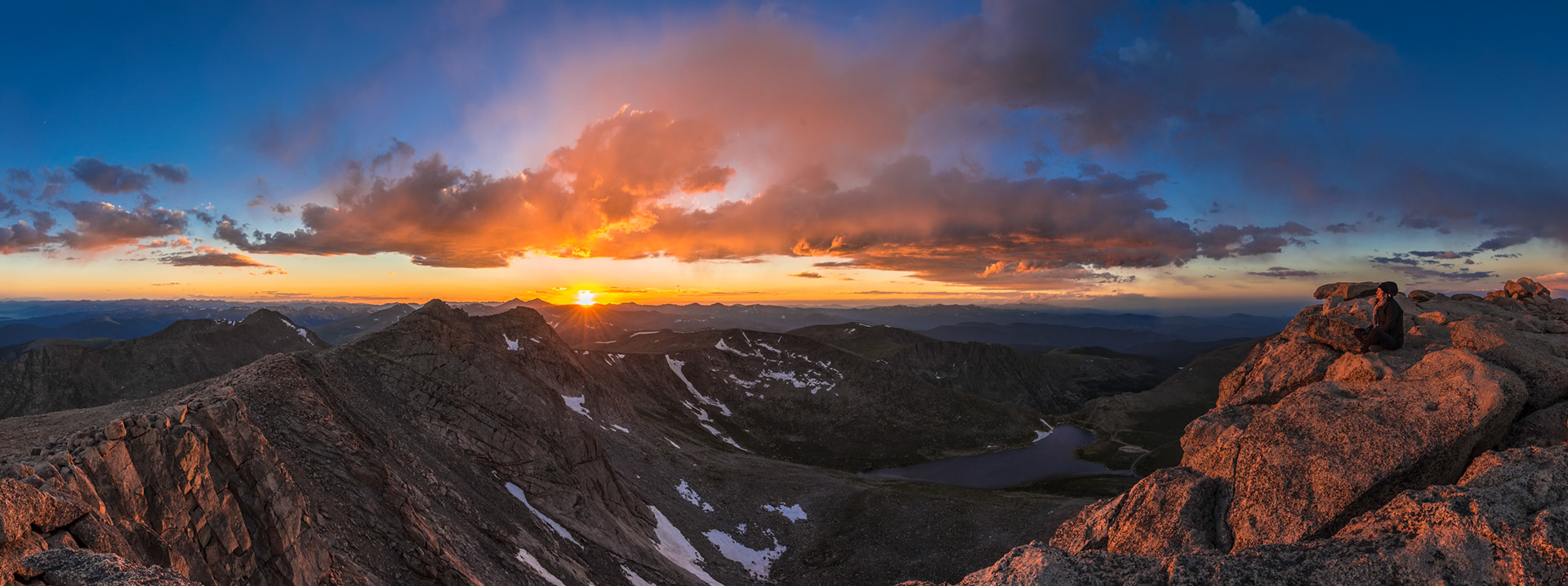 Sunset from Mt Blue Sky, view on Summit Lake and Rocky Mountains.  Mount Blue Sky is the highest summit of the Chicago Peaks in the Front Range of the Rocky Mountains of North America. The prominent 14,271-foot (4350 m) fourteener is located in the Mount Evans Wilderness, 13.4 miles (21.6 km) southwest of the City of Idaho Springs in Colorado, USA