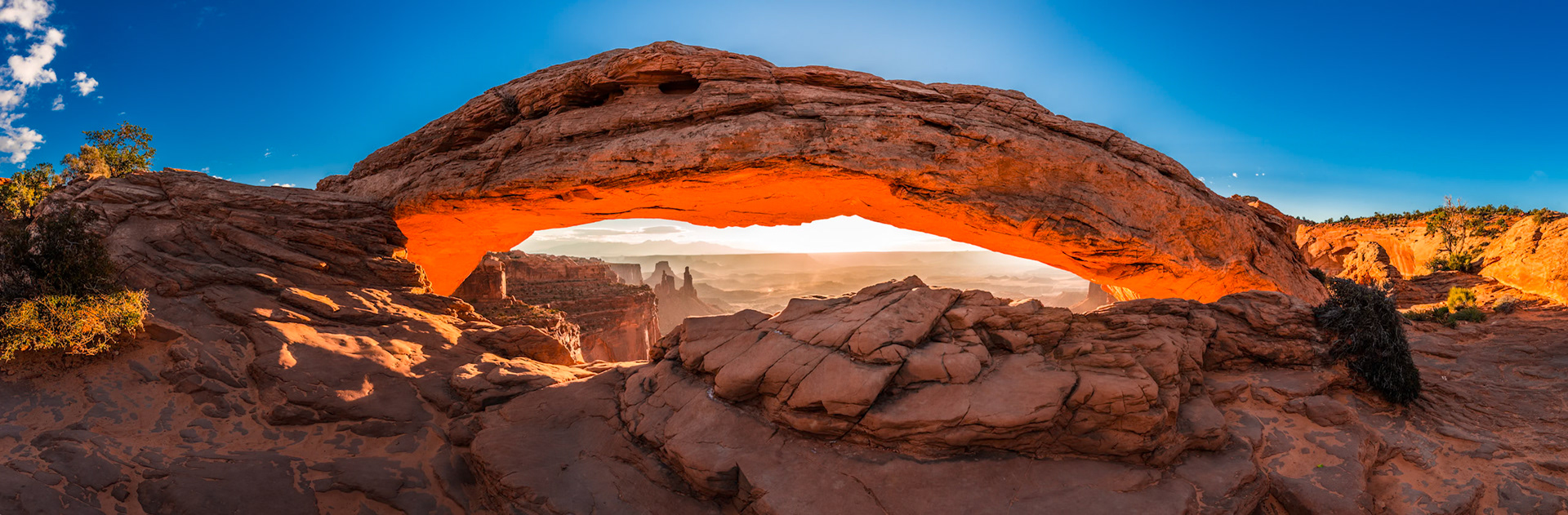 Mesa Arch, Utah, sunrise creates an amazing glow inside the arch. 225° Panorama