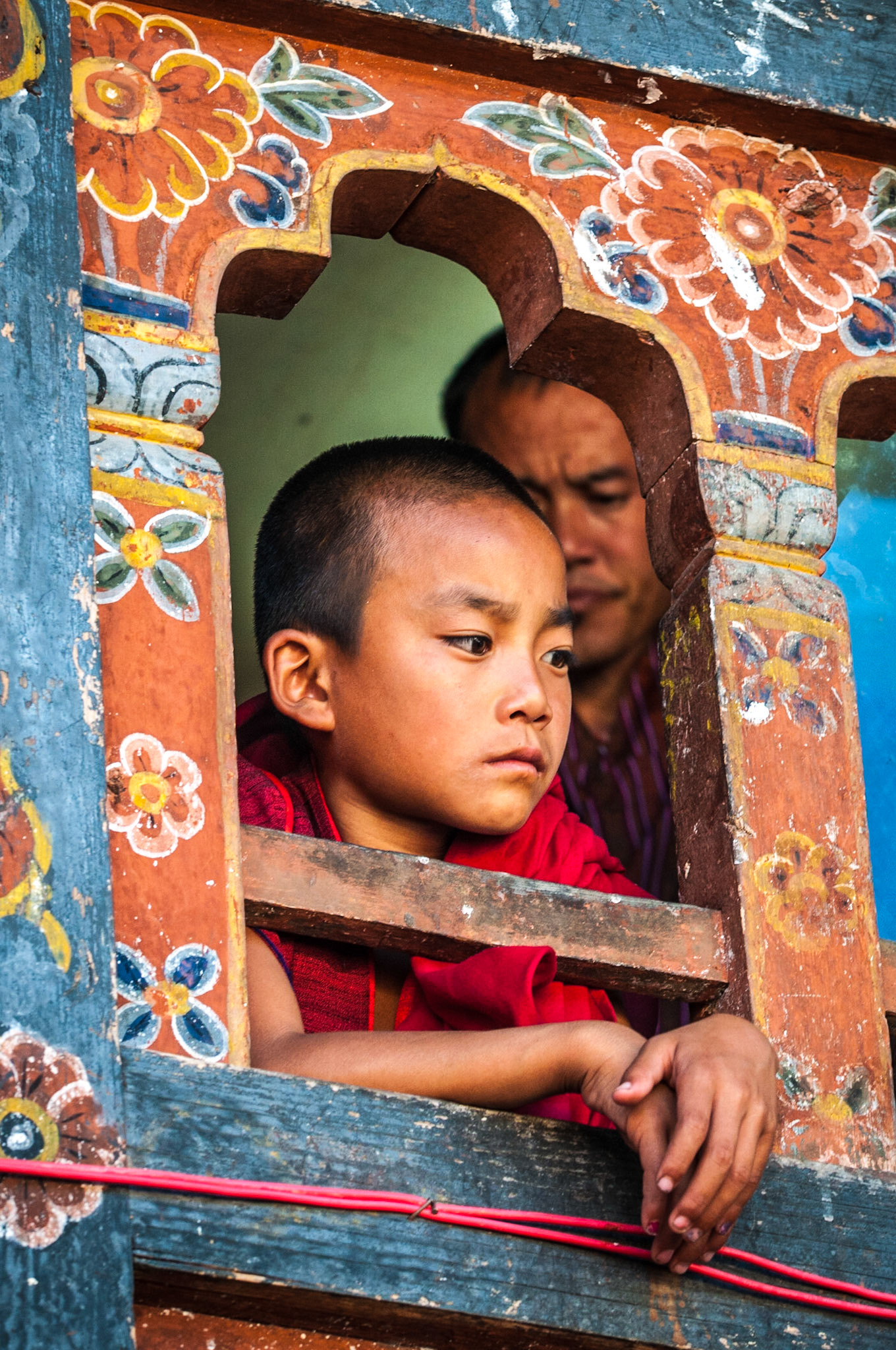 Young monk at Bhutan monastry during Tshechu Festival at Wangdue Phodrang Dzong in 2011