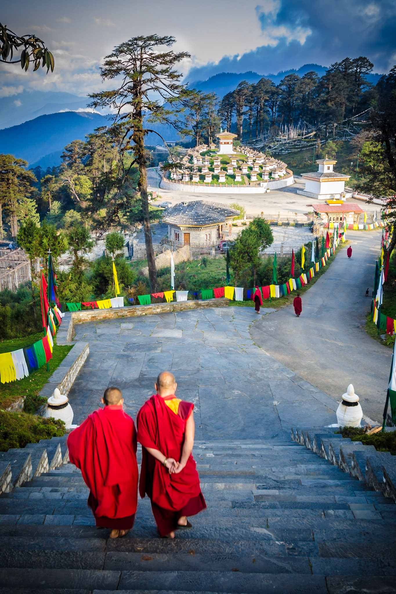 The Dochula Pass is a mountain pass in the snow covered Himalayas within Bhutan on the road from Thimpu to Punakha where 108 memorial chortens or stupas known as "Druk Wangyal Chortens" have been built by Ashi Dorji Wangmo Wangchuk, the eldest Queen Mother. Apart from the chortens there is a monastery called the Druk Wangyal Lhakhang (temple), built in honour of the fourth Druk Gyalpo (head of the state of Bhutan), Jigme Singye Wangchuck
