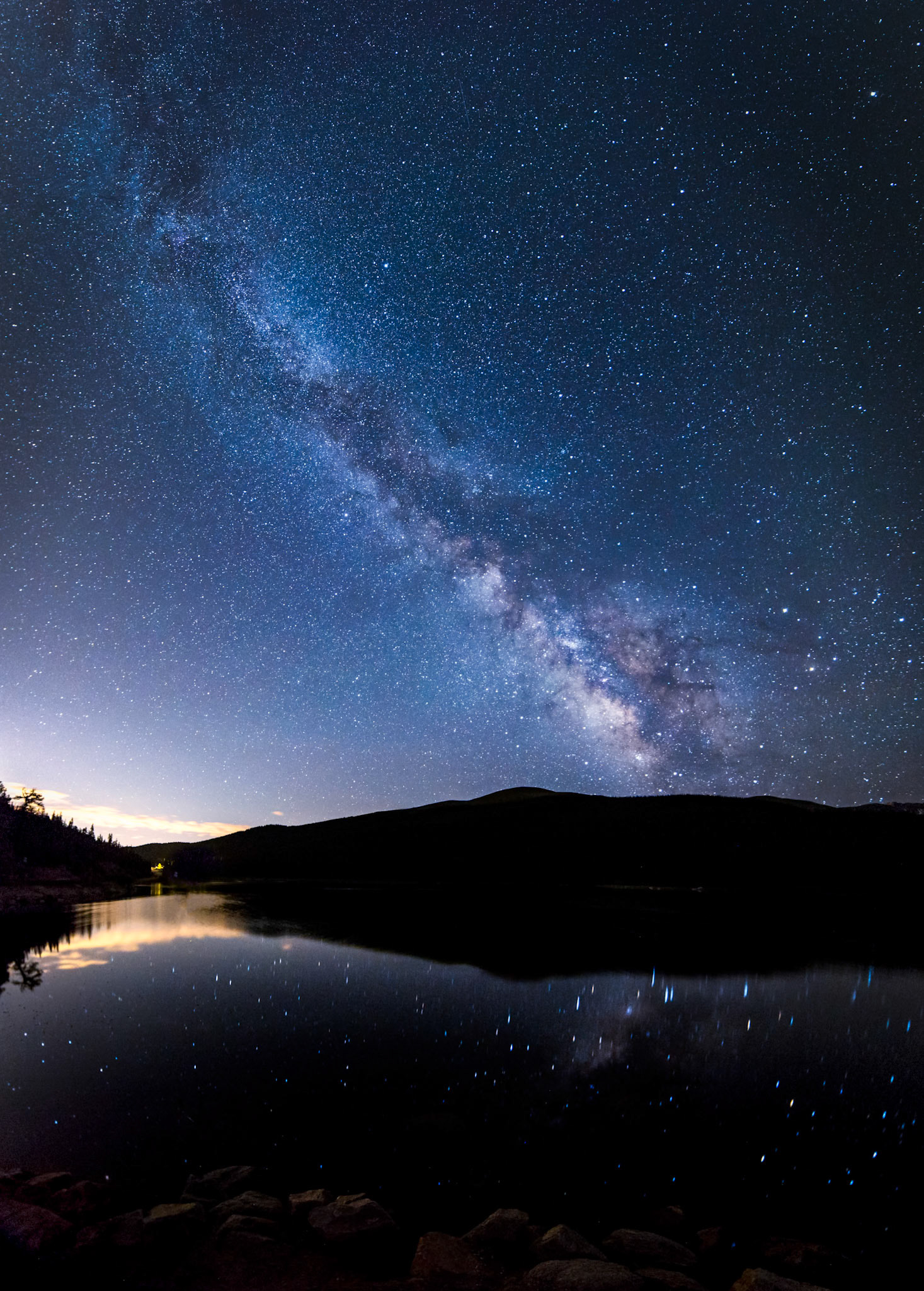 Milky Way over Echo Lake, near Mt.Evan,Colorado. Star sky reflected in the lake. Vertical Panorama 215˚ stiched from 14 images.