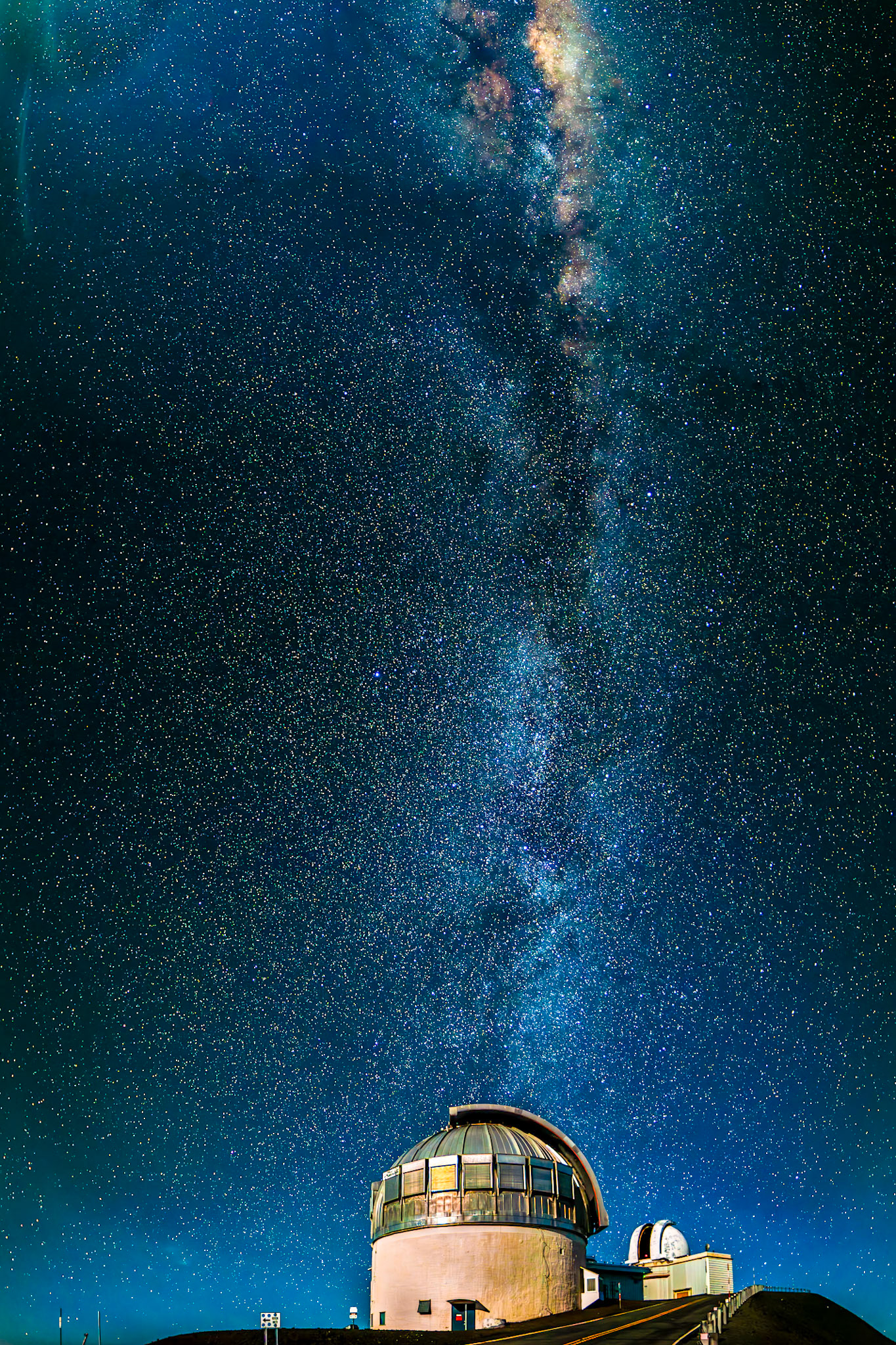 Extremely clear night sky on Mauna Kea (Hawaii) for milkyway vertical 8 image panorama above the 3.8m UK Infrared Telescope (UKIRT) and the UH 2.2m in the background