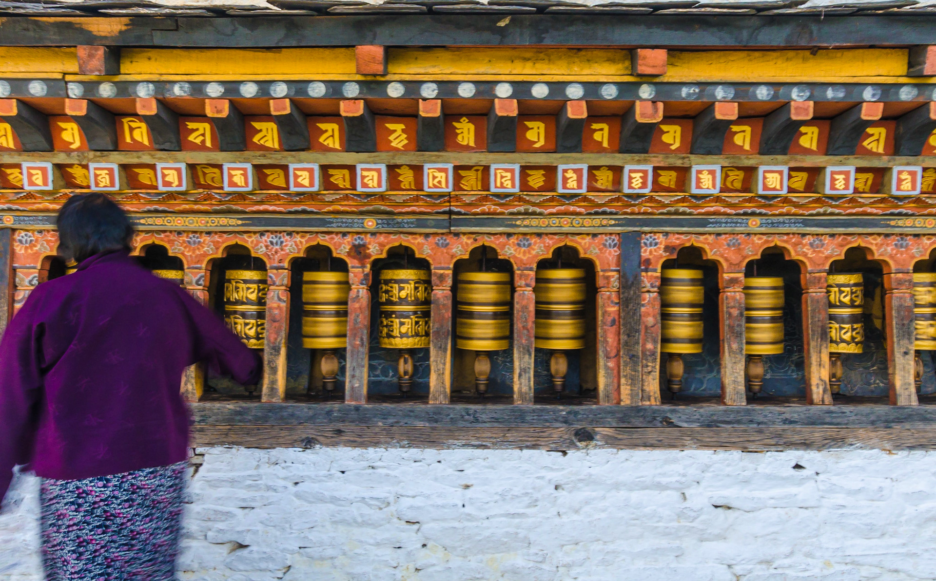 Bhutanese temple typically have many "prayer wheels" which contain paper rolls of hundreds of meters covered with hand-written prayers and mantras. By turning the wheels (always clockwise!) the faithful can "efficiently" send thousands  of prayers in a few minutes.