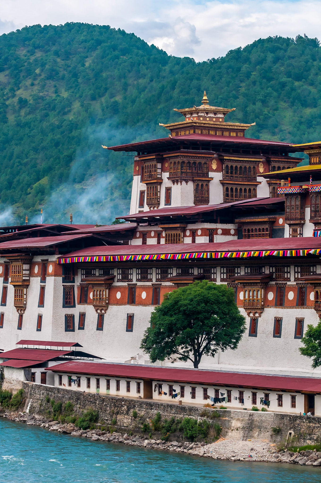 The Dzong is located at the confluence of the Pho Chhu (father) and Mo Chhu (mother) rivers in the Punakha–Wangdue valley. The Punakha Dzong, also known as Pungtang Dechen Photrang Dzong (meaning very awesome dzong "the palace of great happiness), is the administrative centre of Punakha District in Punakha, Bhutan.it is the second oldest and second largest dzong in Bhutan and one of its most majestic structures. Punakha Dzong was the administrative centre and the seat of the Government of Bhutan until 1955, when the capital was moved to Thimphu.