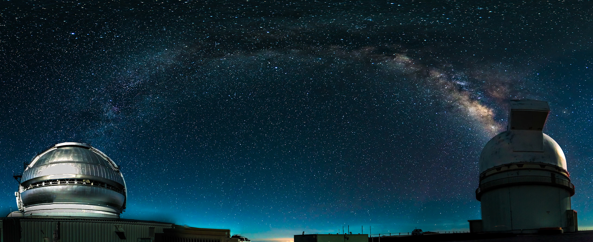 Mauna Kea  night sky with Gemini Telescope (left) and University of Hawai‘i 2.2-meter telescope ( right) and Milkyway arching above (arch due to panorama projection)