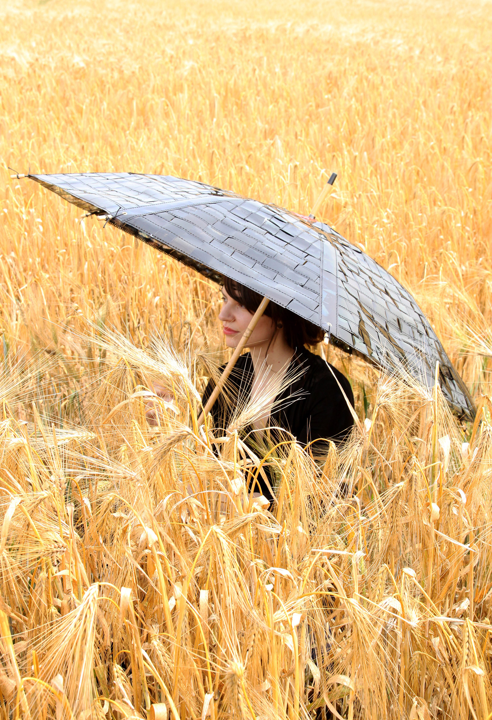 textile art project No. 1: Nadine with umbrella made from old slide film, yarn and tape