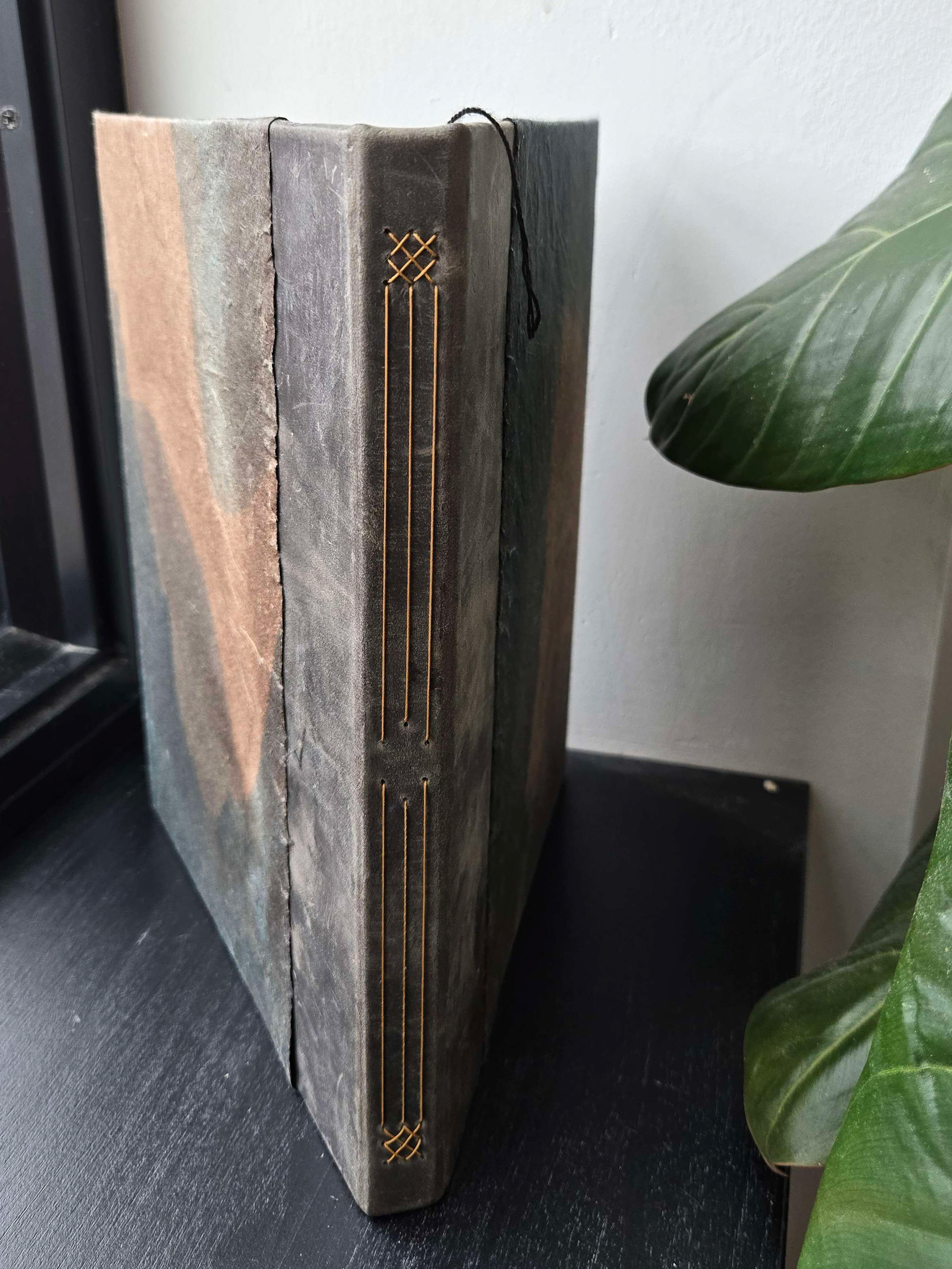 exposed longstitch spine