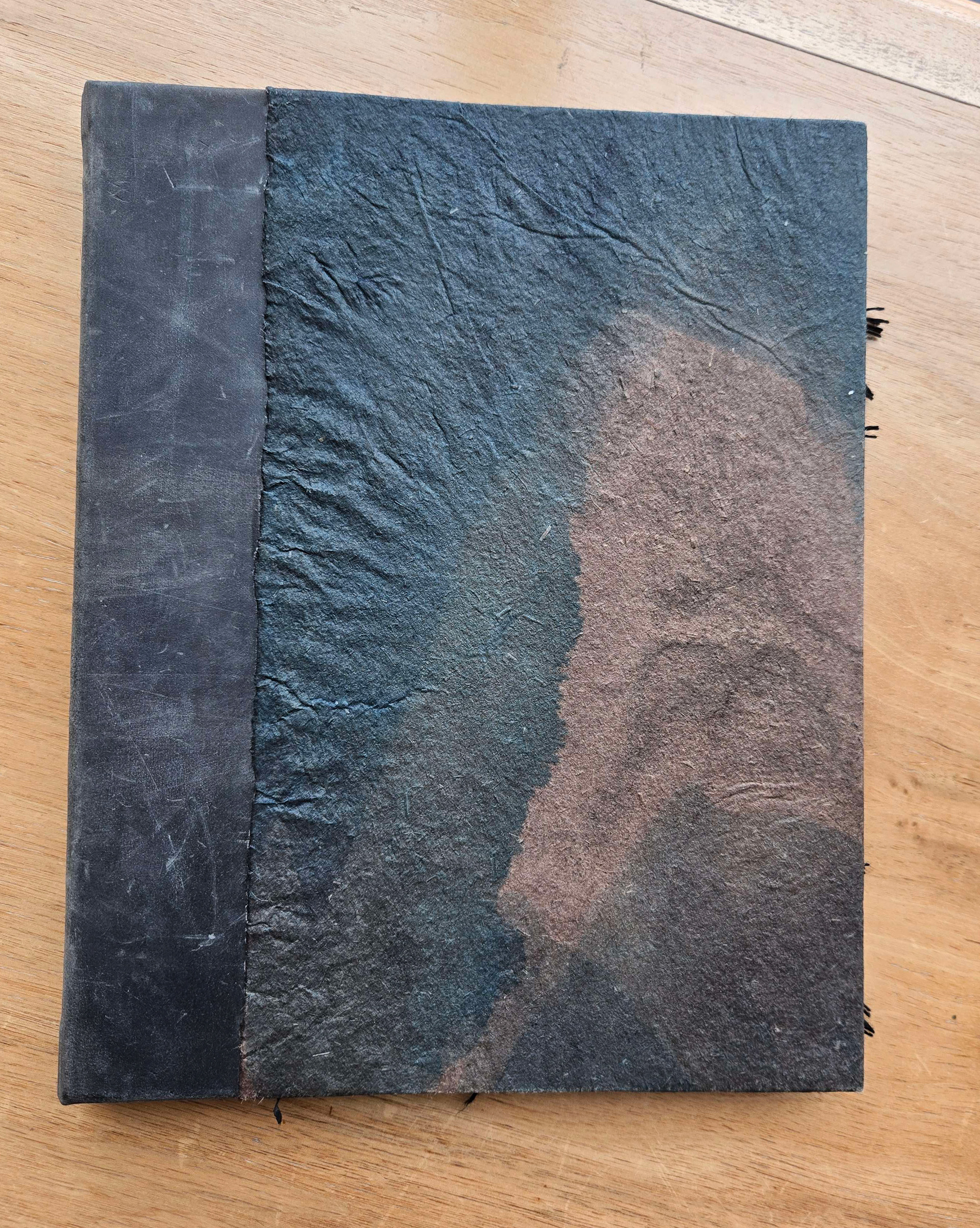 cave paper cover and leather spine
