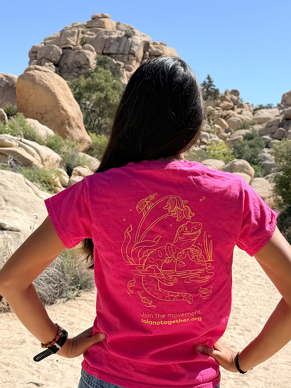 Erin McGarry modeling the tee with her salamander illustration on the back.