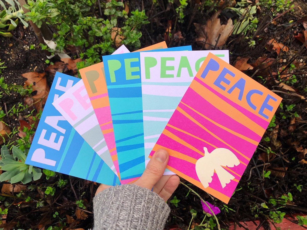 Cards that say Peace and have a dove on them. The cards are all different color combinations.