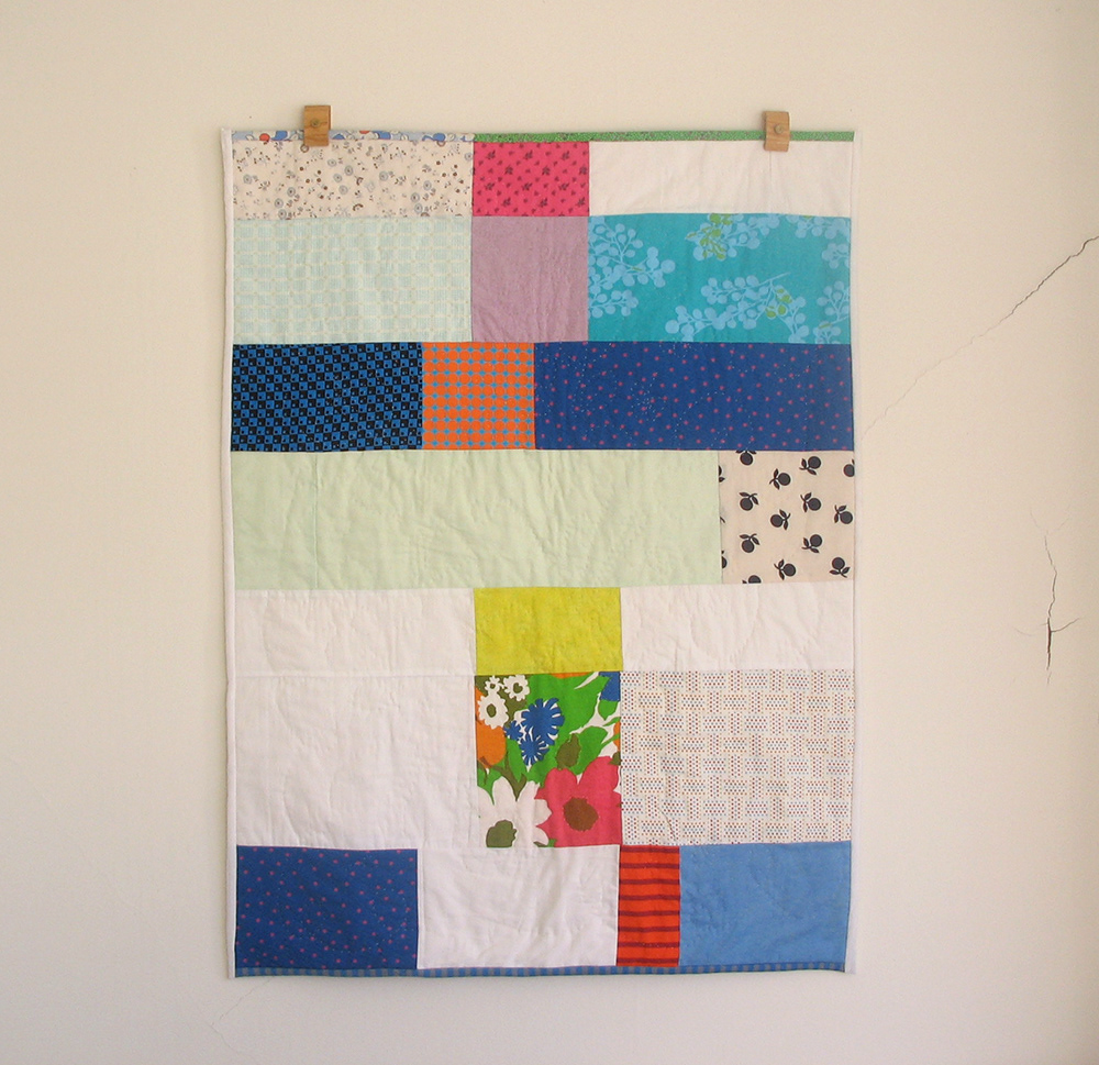 Strip quilt for a baby