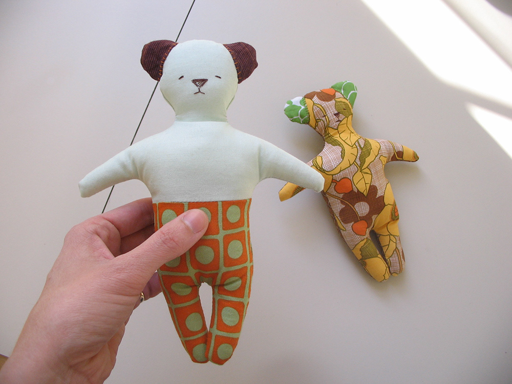 Two small sewn bears in patterned fabrics