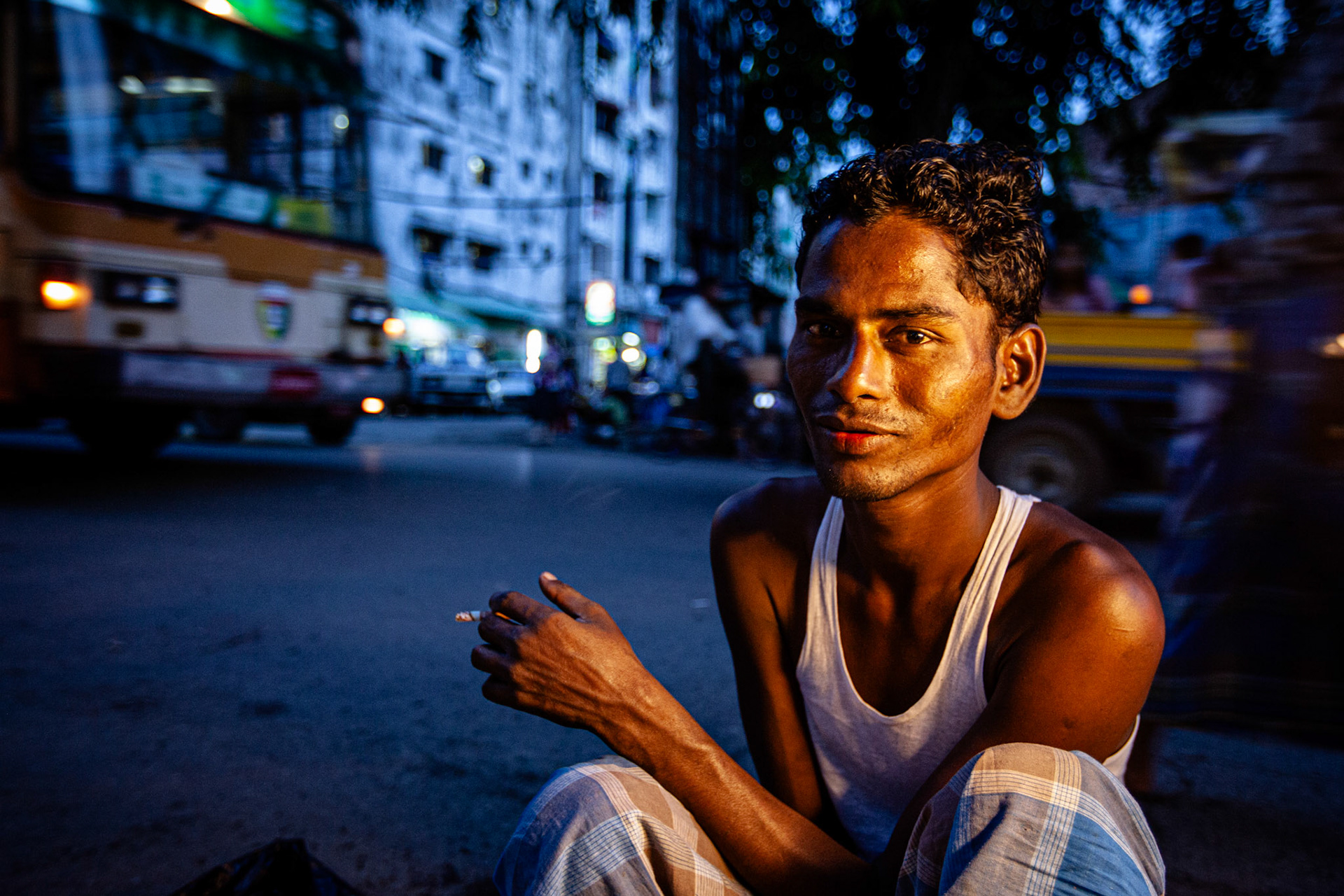 Smoking seller. Yangon, Myanmar