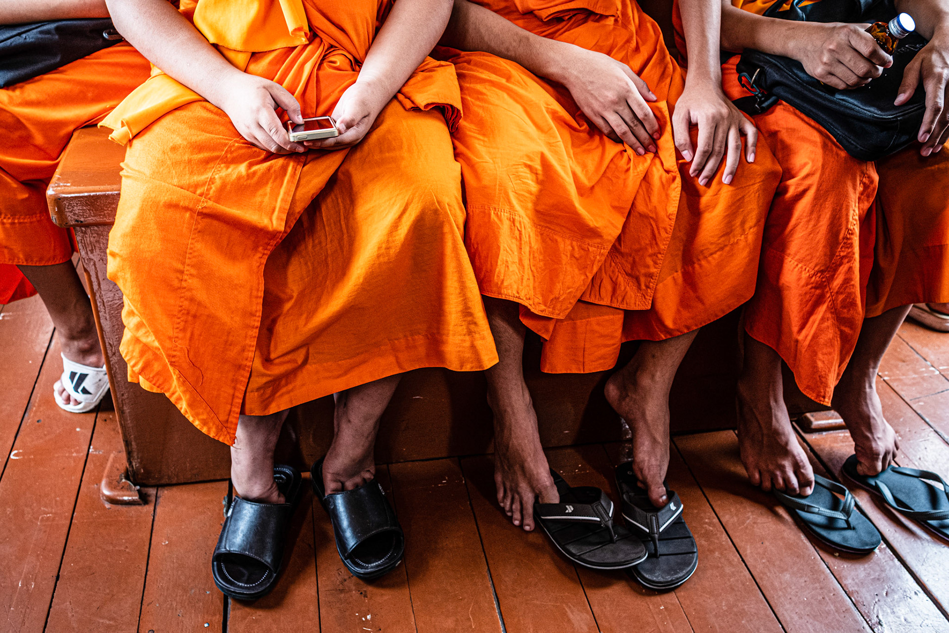 Bangkok, Thailand - 04 September 2018: Novice monks playing in a smartphone