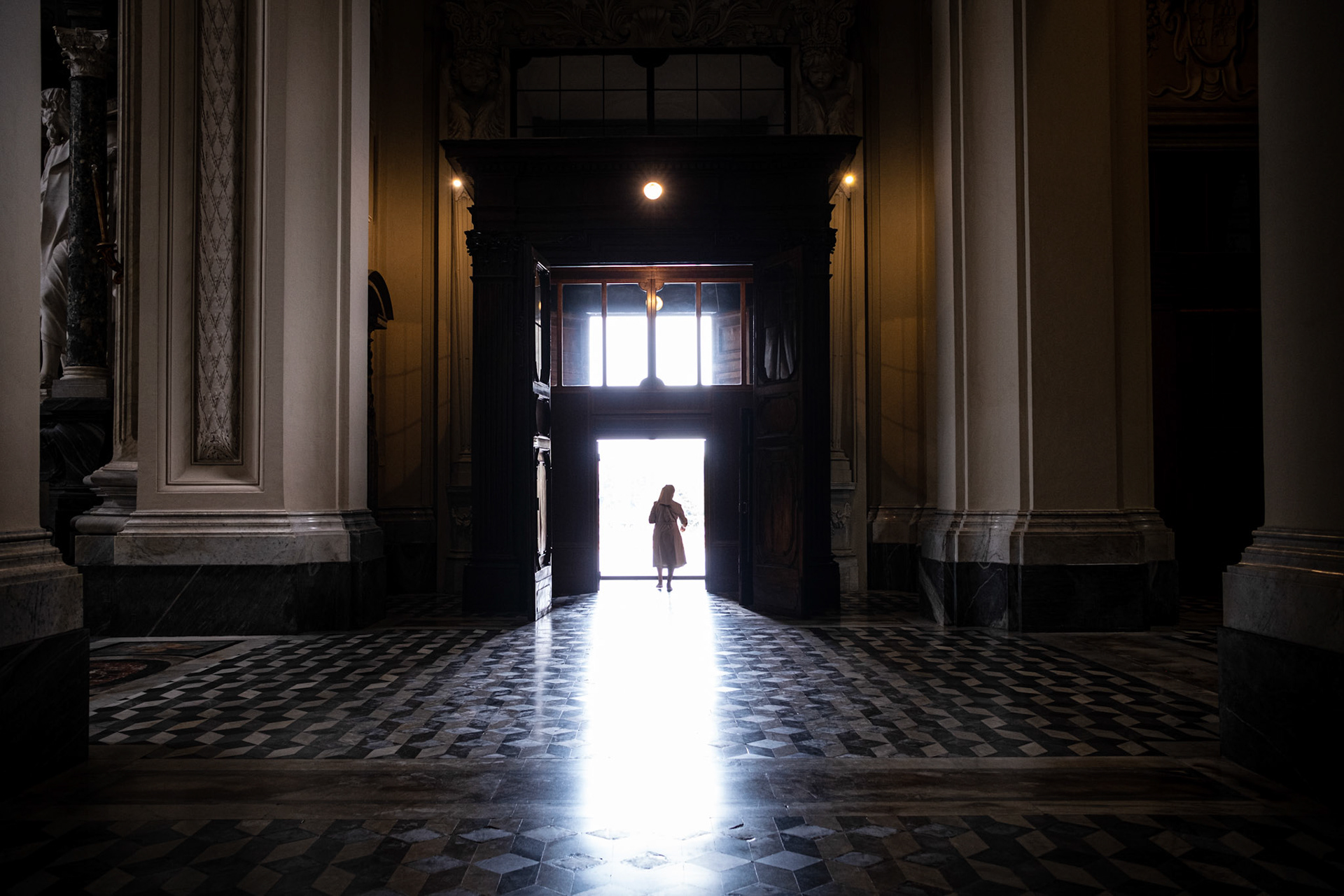 Rome, Italy - 09 August 2022 : Nun exiting Basilica di San Giovanni in Laterano