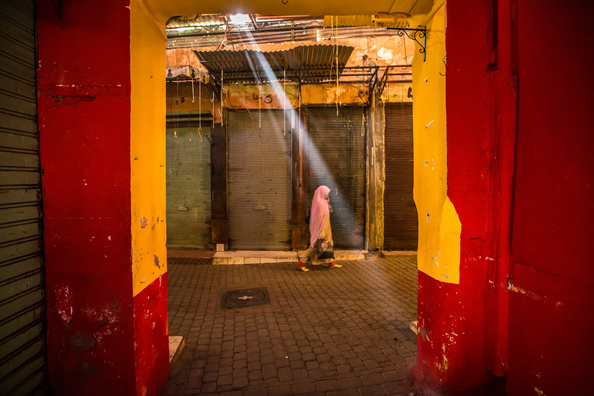 Woman walking in the Marrakesh souk. Morocco