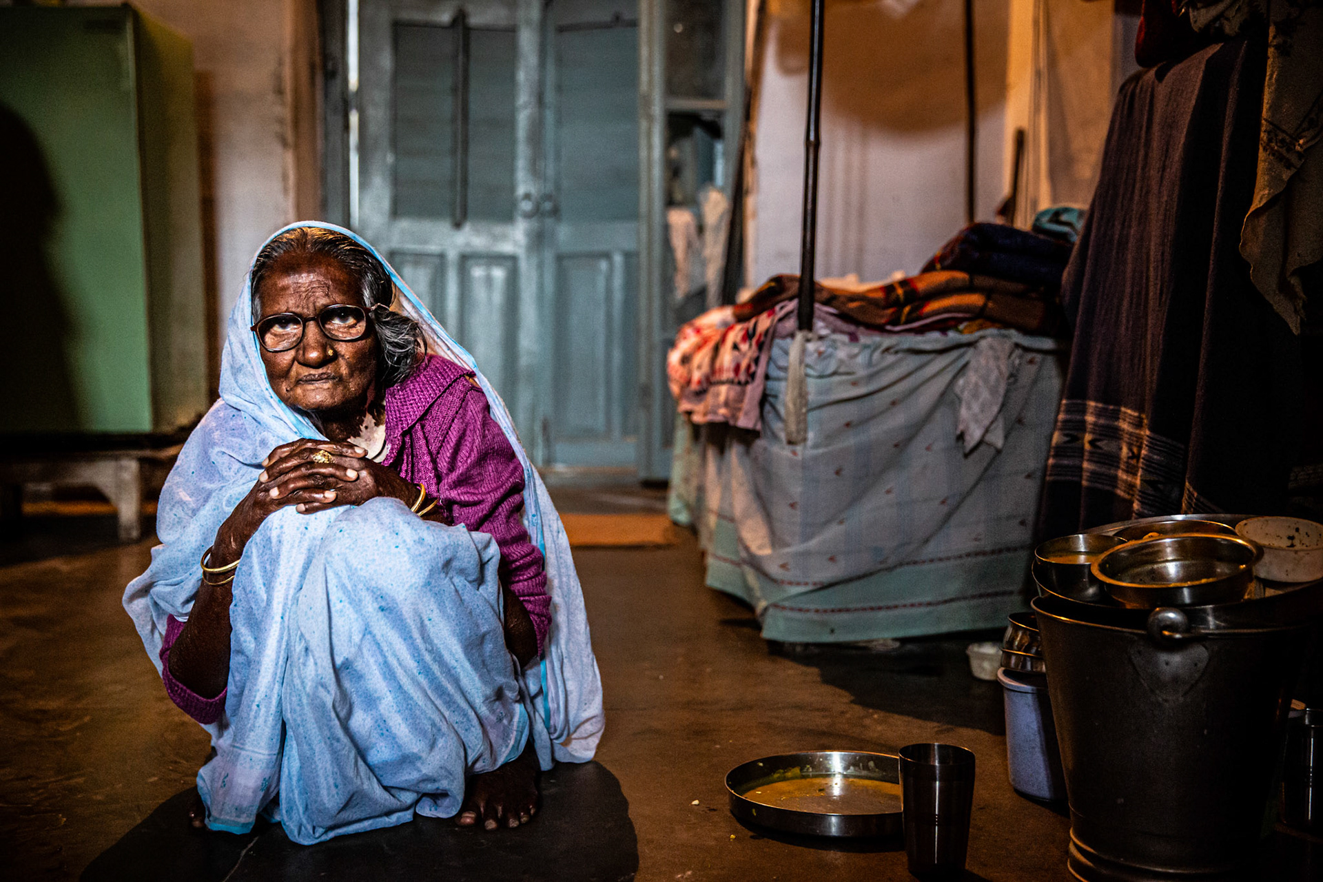 Widow sitting inside an ashram. Varanasi, India