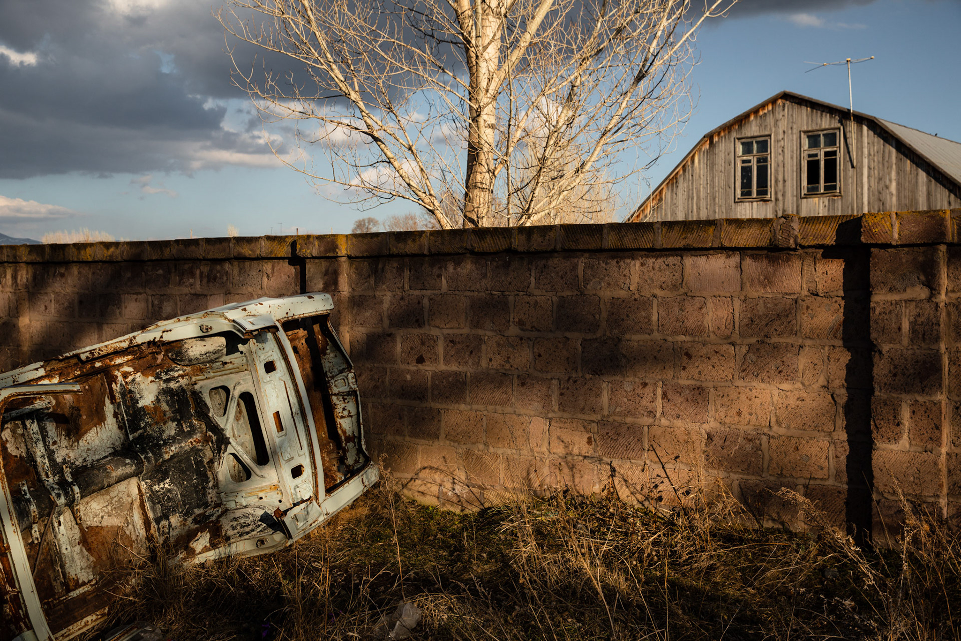 Old soviet car chassis against a wall in Gyumri. Armenia