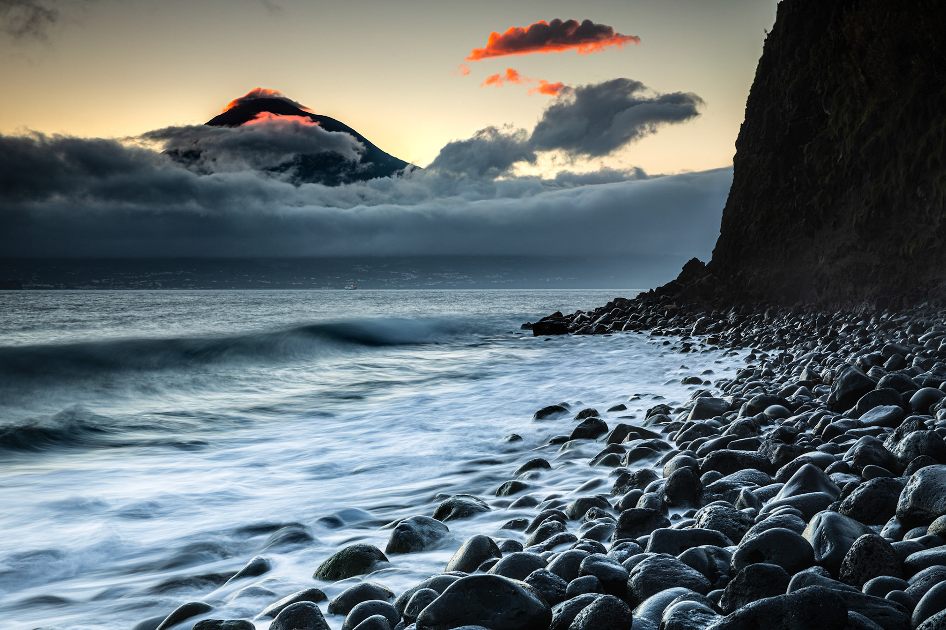 Sunrise at Praia do Almoxarife with a view over Pico. Faial, Azores, Portugal