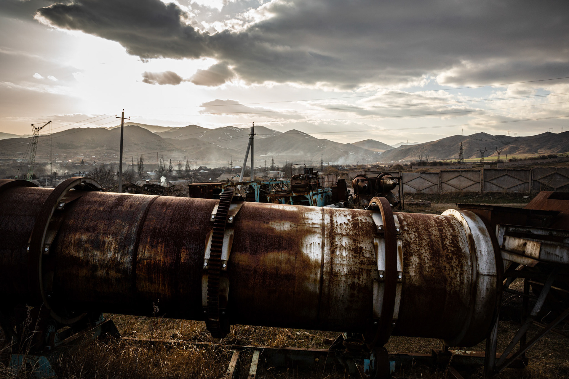 Abandoned industry equipment in a field. Shirak, Armenia