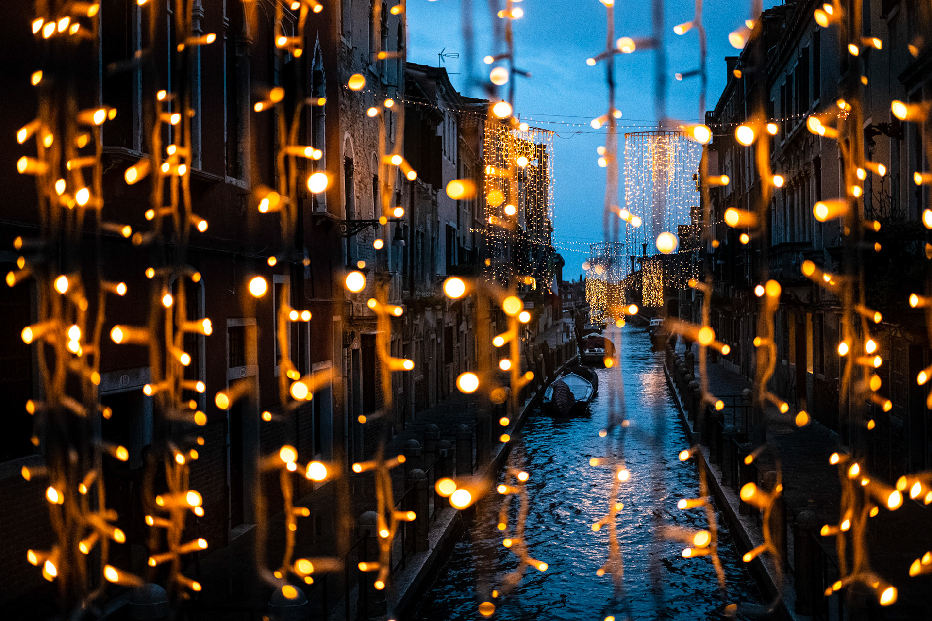 Venice, Portugal - 11 December 2017: Venice canal behind yellow decorative lights